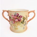 An early 20th century Royal Worcester blush porcelain loving cup: two-handled and hand-decorated