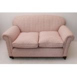 An early 20th century (later re-upholstered) drop-end club-style two-seater sofa (141 wide x 79 deep