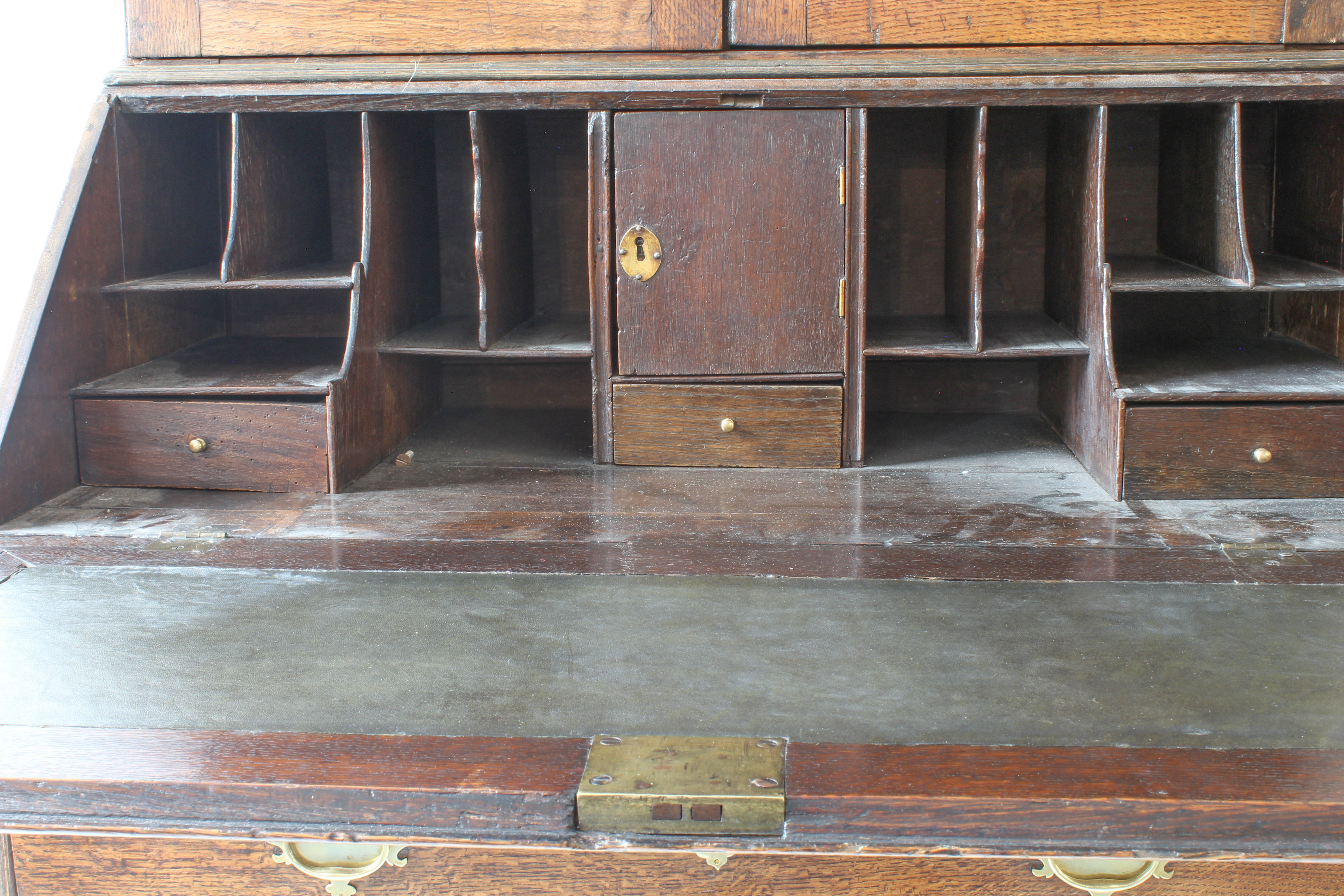 A mid-18th century oak bureau-cabinet: two high fielded panel doors opening to reveal shelves; - Image 5 of 6