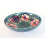 A mid-20th century Moorcroft pottery bowl: tube-lined and hand-decorated in the 'Anemone'