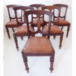 A set of six mid-19th century mahogany dining chairs (possibly campaign chairs): each with two large