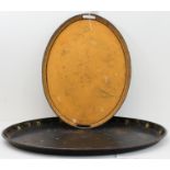 A 19th century tole peinte oval serving tray. the border decorated with flowers; together with one
