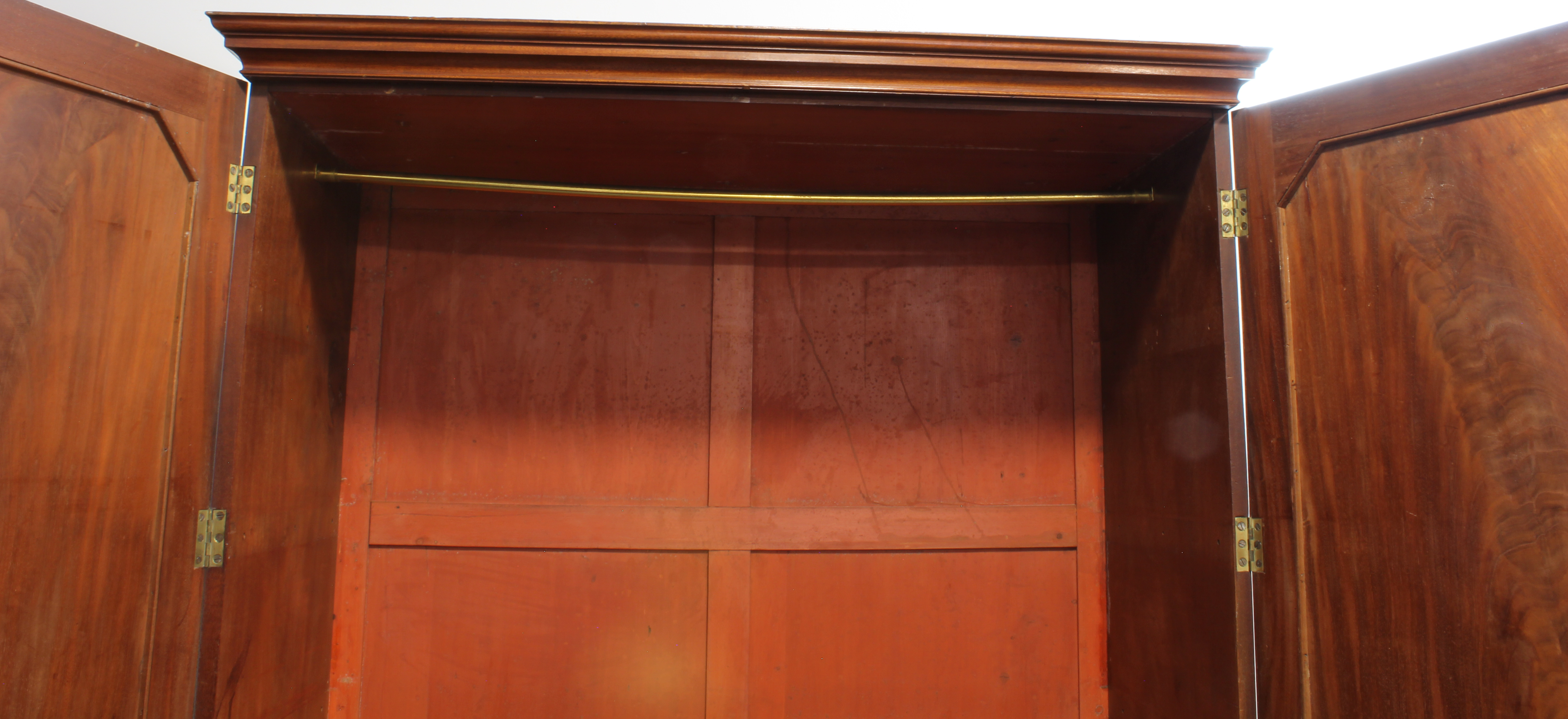 A late 18th century mahogany linen press: short outset cornice above two figured panel doors - Image 2 of 3
