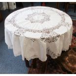 An early 20th century circular white lacework tablecloth (approx. 196 cm in diameter)