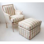A good French-style armchair of large proportions and with matching pouffe: scrolling arms, raised