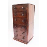 A 19th century mahogany tabletop bank of six drawers: thumbnail moulded top and plinth-style base (