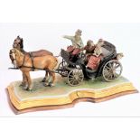 A large and impressive Capodimonte porcelain model: courting couple riding in a two-horse carriage