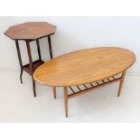 Two pieces: 1. a mid-20th century oval-topped figured wood coffee-table raised on turned tapering