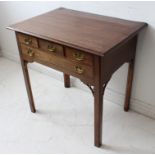 An 18th century mahogany lowboy: moulded overhanging top; three top drawers and one full-width