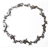 A silver bracelet modelled as eight leaping dolphins (19.25cm) (presentation box)