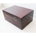 A modern Chinese red-lacquered trunk in antique style and with two side-handles (LWH 82 x 55.5  x