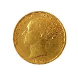 An 1871 gold sovereign (young head obverse and royal arms reverse).