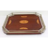 An Edwardian octagonal mahogany serving tray: boxwood-strung and boxwood marquetry patera; silver-