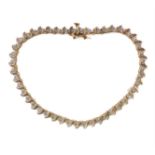A gold tennis bracelet (marked 14K to the clasp) and set with 46 diamonds (19 cm; total weight