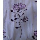 A pair of lavender and gold shot silk-effect curtains embroidered with sprigs of flowers; triple