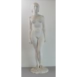 A white plaster model of a female nude standing upon a gravel-style base (84 cm high).  (Small