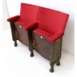 A late 19th century conjoined pair of red-velour-upholstered and cast iron theatre seats (nos. 34