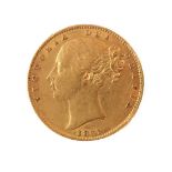 An 1861 gold sovereign (young head obverse and royal arms reverse).