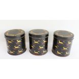 A set of three circular tin Art Deco Revival (c. 1974) storage jars and covers decorated in gilt and