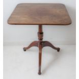 An early 19th century square mahogany tilt-top occasional table: turned stem, three downswept
