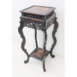 A late 19th century Chinese ebonised softwood jardinière of square form: carved pierced friezes