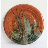 A large Cobridge stoneware trial piece wall-hanging charger: hand decorated with cacti against a