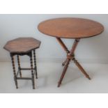 Two pieces: 1. a 19th century walnut gypsy table base with later circular top (66 cm in diameter x