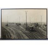 A very large original monochrome photograph of a railway yard with carriages and locomotives (