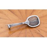 A 1920s or 1930s silver (unmarked) brooch modelled as a fully-strung tennis racket with early-