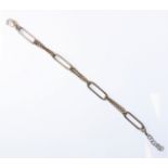 A silver bracelet modelled as four elongated oval links united by chains (19.5cm, boxed)