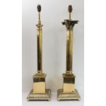 Two polished brass table-lamps modelled as a Corinthian and a Tuscan column, both with reeded