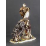 A large hand-decorated Capodimonte porcelain model of Don Quixote in full armour and on horseback,