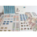 A collection of stamps and 12 banknotes: 1. a sheet of 60 stamps Robert Burns 4d stamps and a