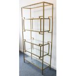 A modern set of vertical shelves with bronze finished geometric frame and glass shelves (LWH 96.5