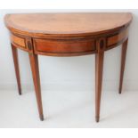 A George III period foldover-top demi-lune card table with satinwood and rosewood crossbanding; four