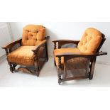 A pair of 1930s oak and rattan-caned armchairs with cushions: adjustable slatted backs with