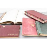 A mixed lot comprising three stamp albums and two unused ledger books: 1. 'Victory and Peace
