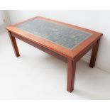A modern bespoke hand-built walnut coffee table with central decorative element of various printer's