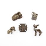 A small selection of silver brooches and charms comprising an engraved Maltese cross brooch, a heavy