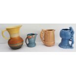 Four ceramic jugs: an Art Deco Shelley example with reeded body and varying colours (34 cm high);