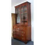 An early 19th century George III period mahogany secrétaire bookcase: the outset cornice above a