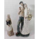 Two part-glazed continental (possibly Spanish) figure models: a couple walking (33 cm high) and a