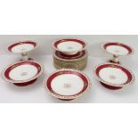 An early 20th century 18-piece part dessert service comprising 12 plates, 4 footed comports (6.5
