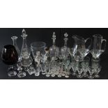 A selection of glassware to include to include drinking glasses, three large cocktail glasses, a set