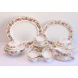 A Royal Worcester 'Royal Garden Elgar' bone china dinner service: 7 x 27 cm and 1 x 20 cm plates;