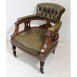 A late 19th to early 20th century mahogany open-arm low chair: bone strung mahogany, green leather