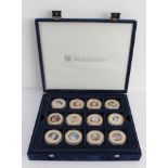 A cased set of 36 gold-plated commemorative coins comprising: 1. 32 x  2012 Diamond Jubilee (24 with