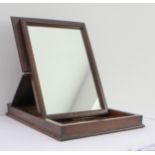 A 19th century oak and mahogany folding campaign-style mirror: the rectangular case with a double