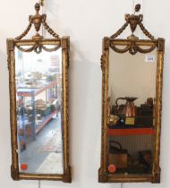 A pair of gilt-framed vertical wall-hanging looking glasses of rectangular section and in late