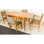 A Gordon Russell of Broadway extending dining table with one extra leaf together with four